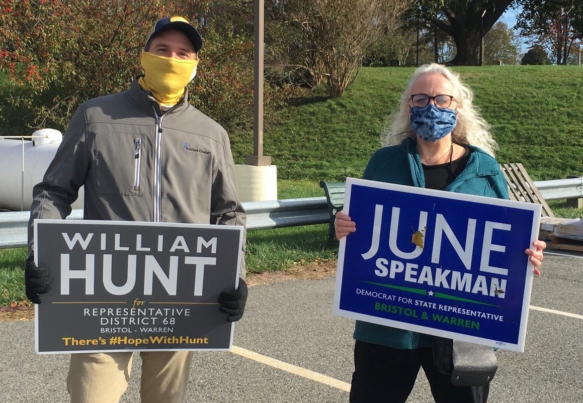 Libertarian Billy Hunt, left, and Democrat June Speakman, right, campaigned next to each other Tuesday at the Quinta Gamelin polling station in Bristol.