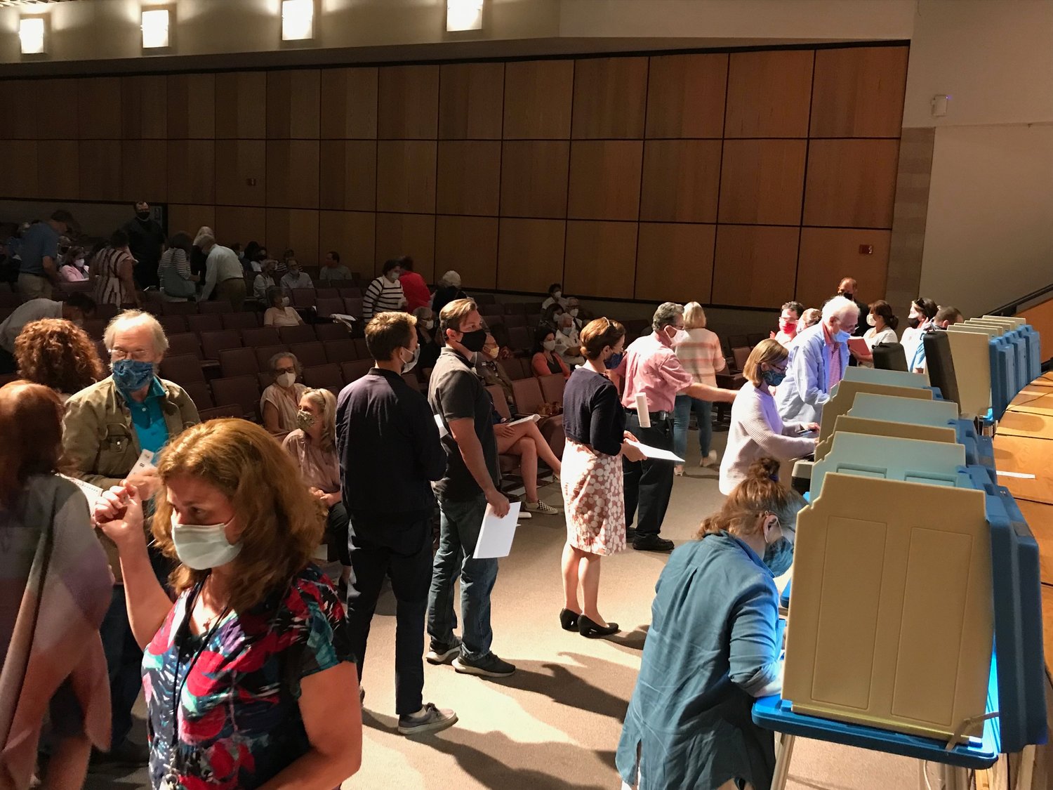 Residents line up to cast their ballots in the $3.5 million vote on Wednesday night at the Barrington financial town meeting. The resolution passed by one vote: 176-175.
