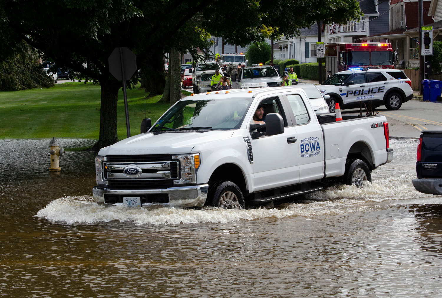 A BCWA employee powers a pick up truck through flooded Hope Street on Thursday morning.