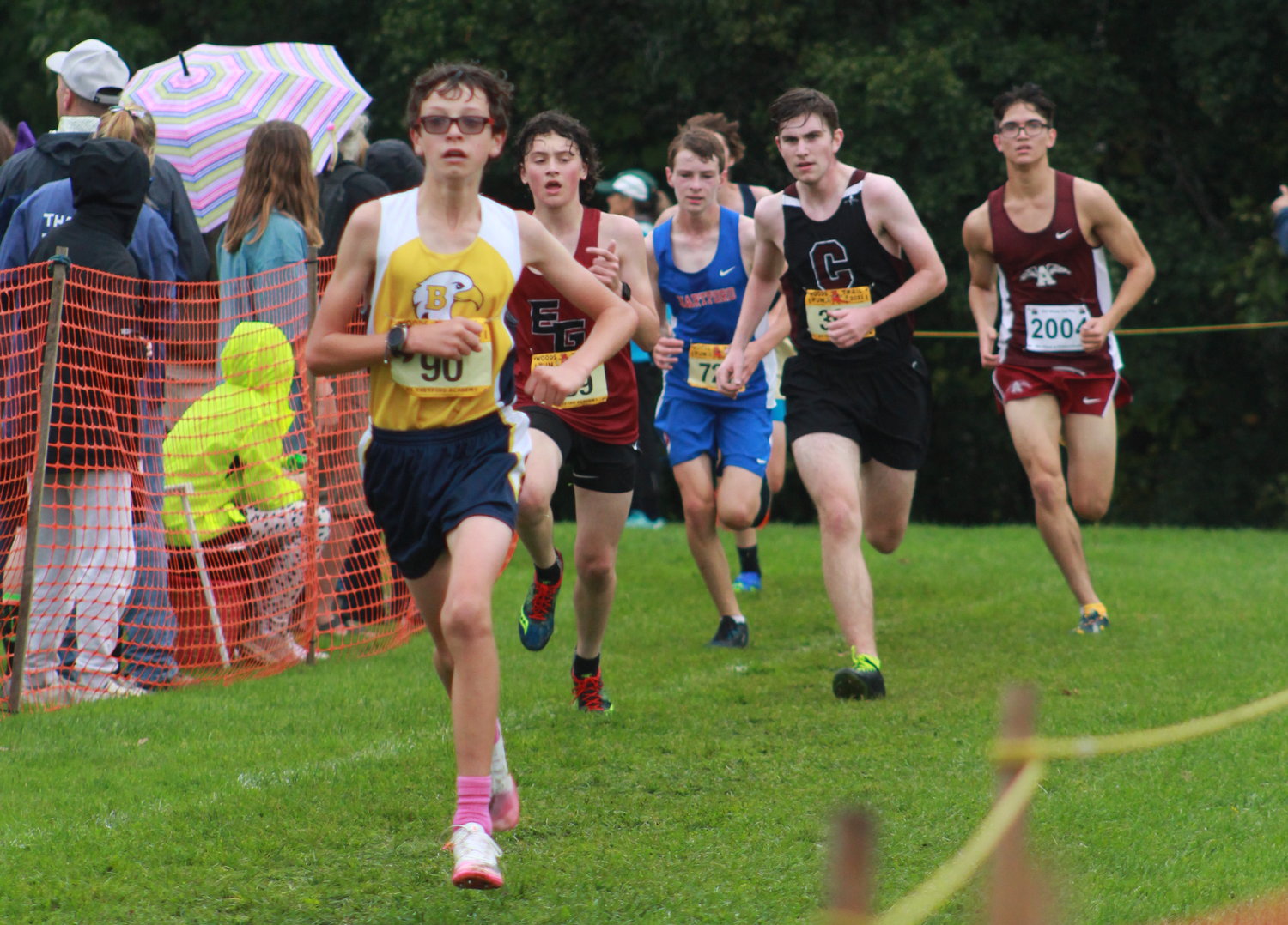Barrington High School’s Sam Barber (left) races to the finish line during the Thetford Invitational cross country race last weekend.