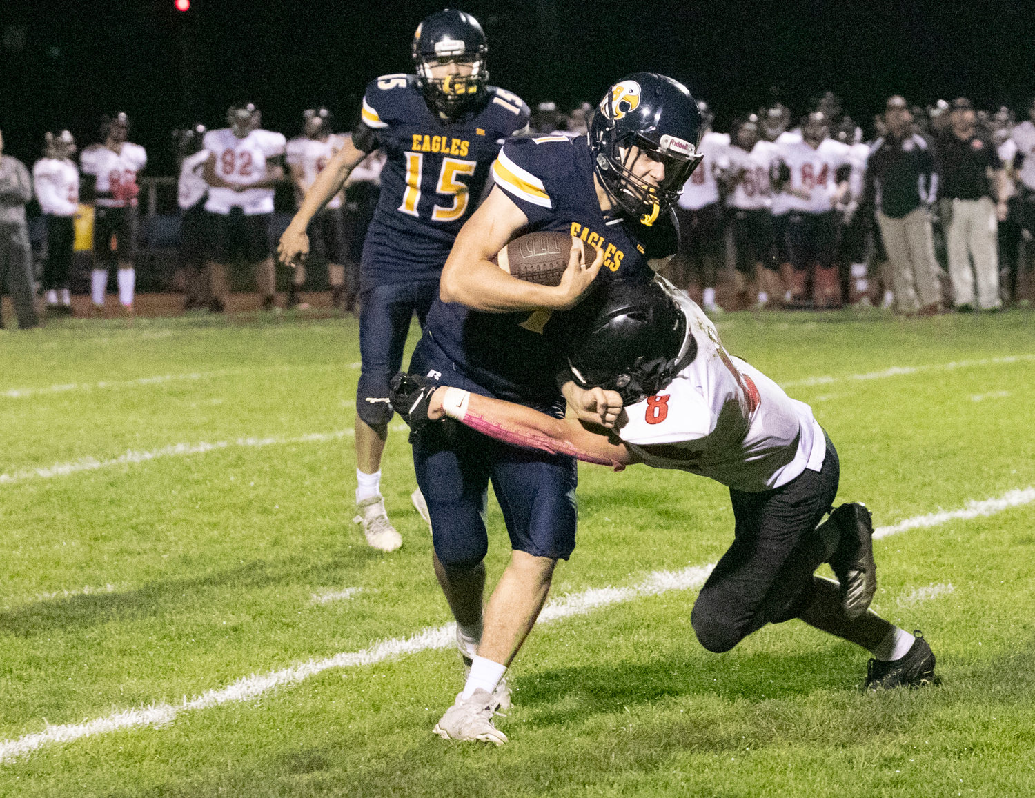 Barrington's Tommy Feroce tries to break a tackle during Friday night's game.
