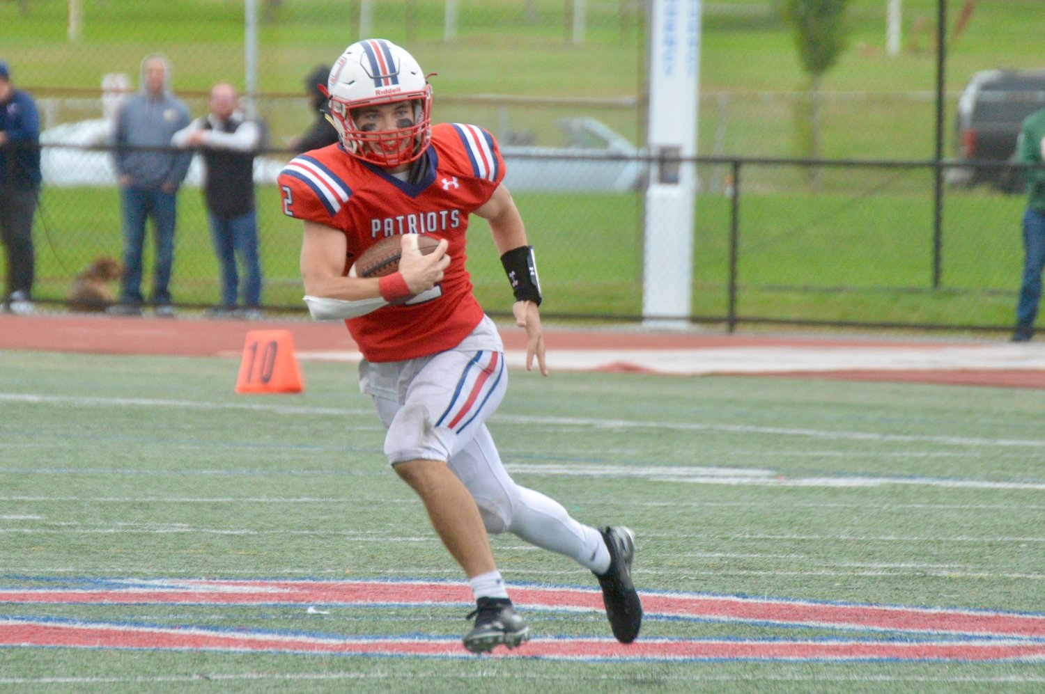 Quarterback Ben Hurd keeps the ball for a gain in the first half.