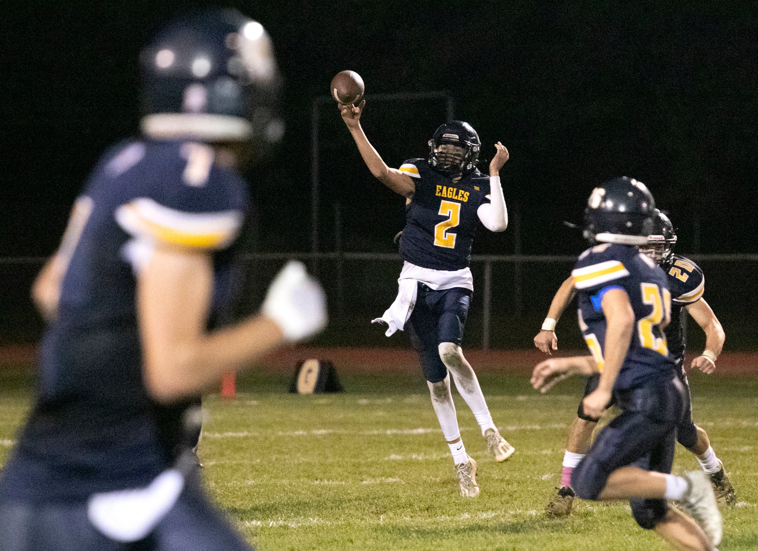 Barrington High School senior quarterback James Anderson releases a pass during the Eagles' win over Rogers on Friday night.