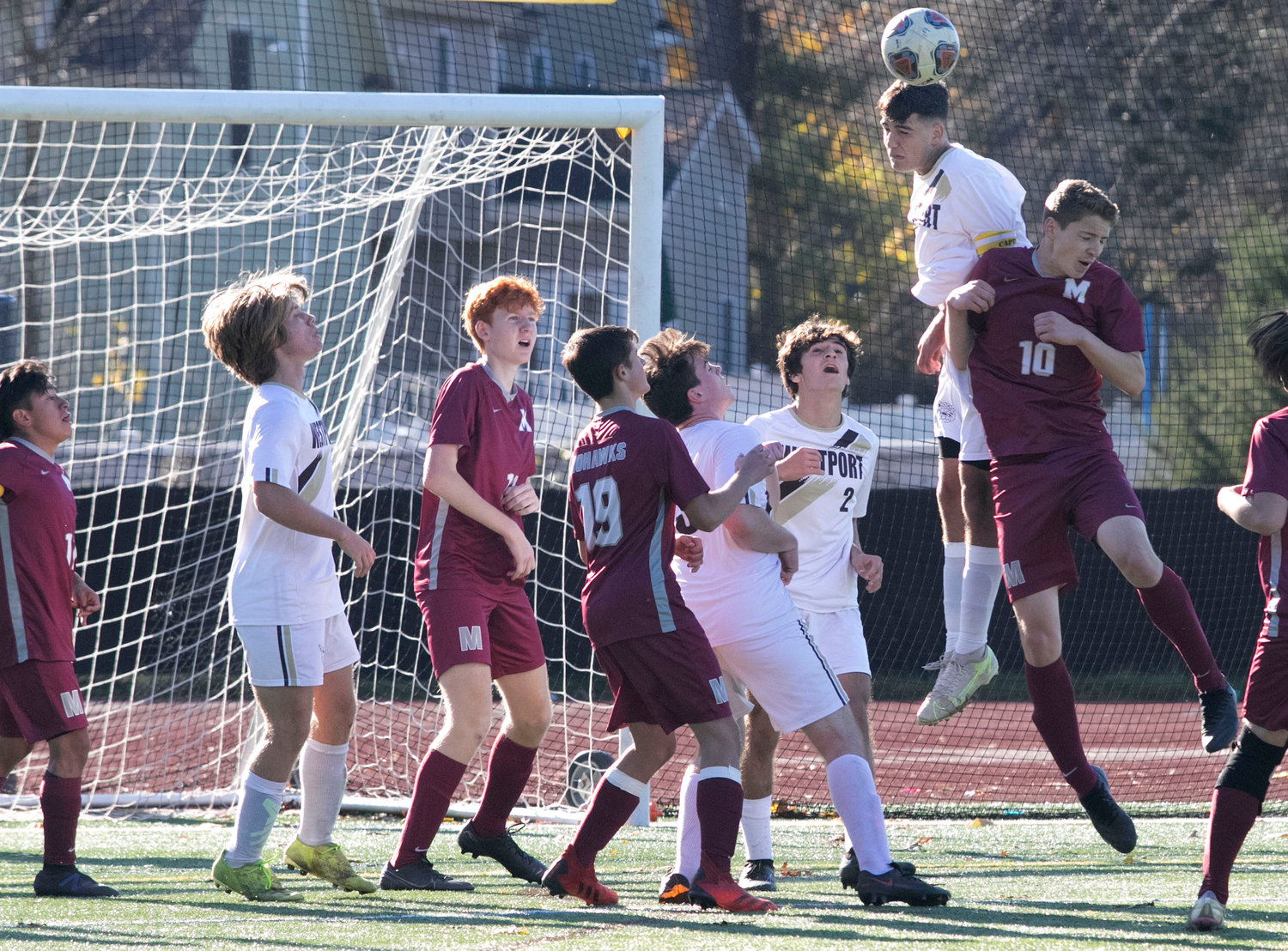 Wildcats Noah Sowle (left), John Letendre, Hunter Brodeur look on as teammate Dom Vitorino out jumps a number of Mohawks to head the ball out of danger during a Millis corner kick late in the game. 