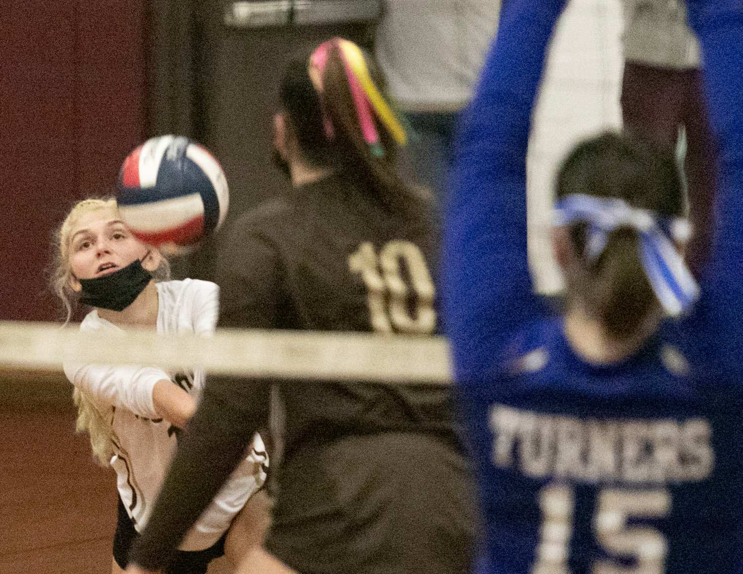 Senior libero Paige Churchill volleys the ball during a game. Churchill led the team defensively, with eight digs.