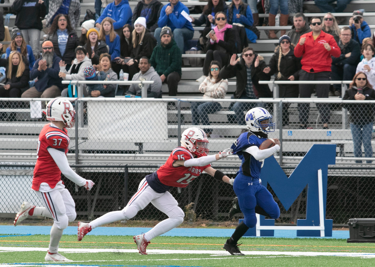 Portsmouth’s Jackson Mello saves a Middletown touchdown by tackling Jacoby Smith as he ran down the left sideline.