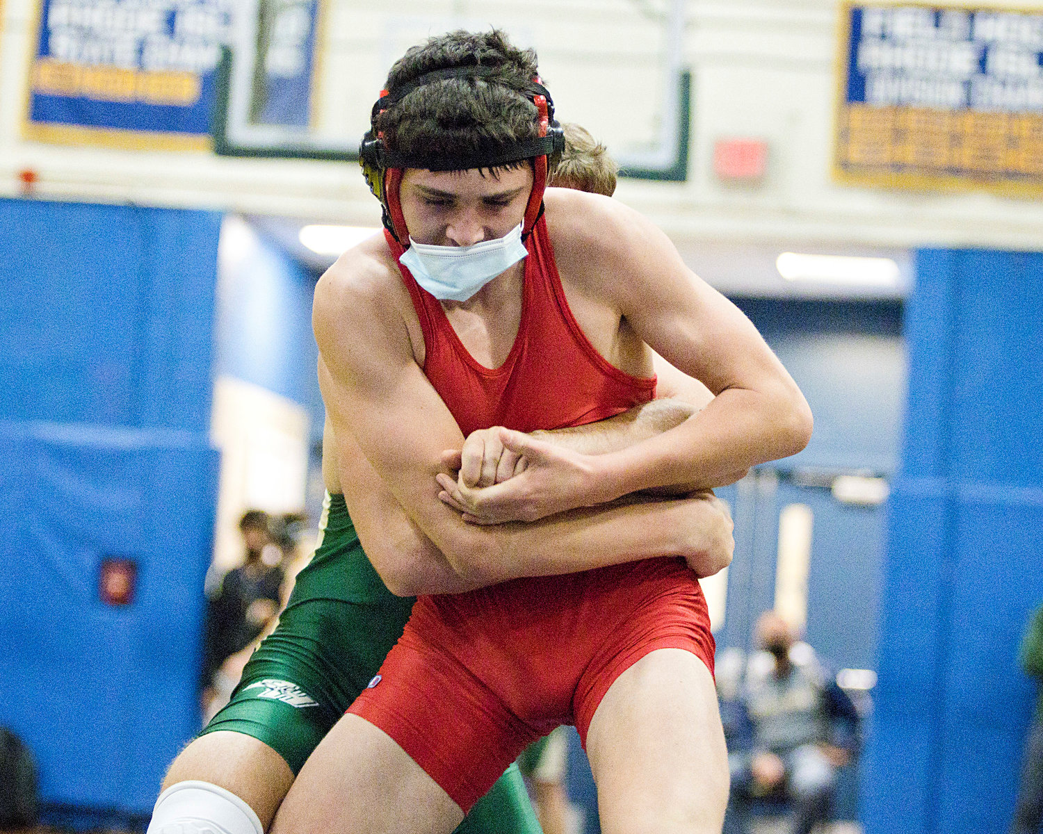 Simon Palumbo grapples with a Hendricken opponent while competing in the 145 lb. weight class.