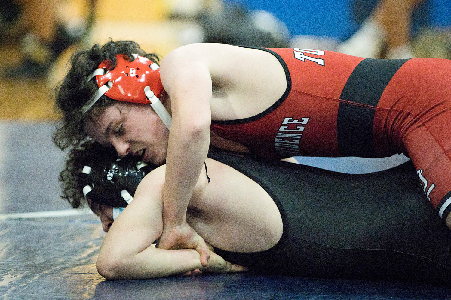East Providence High School’s Louis Pacheco Jr. controls his opponent while competing against Hendricken in the 132lb. weight class at Barrington earlier this season.