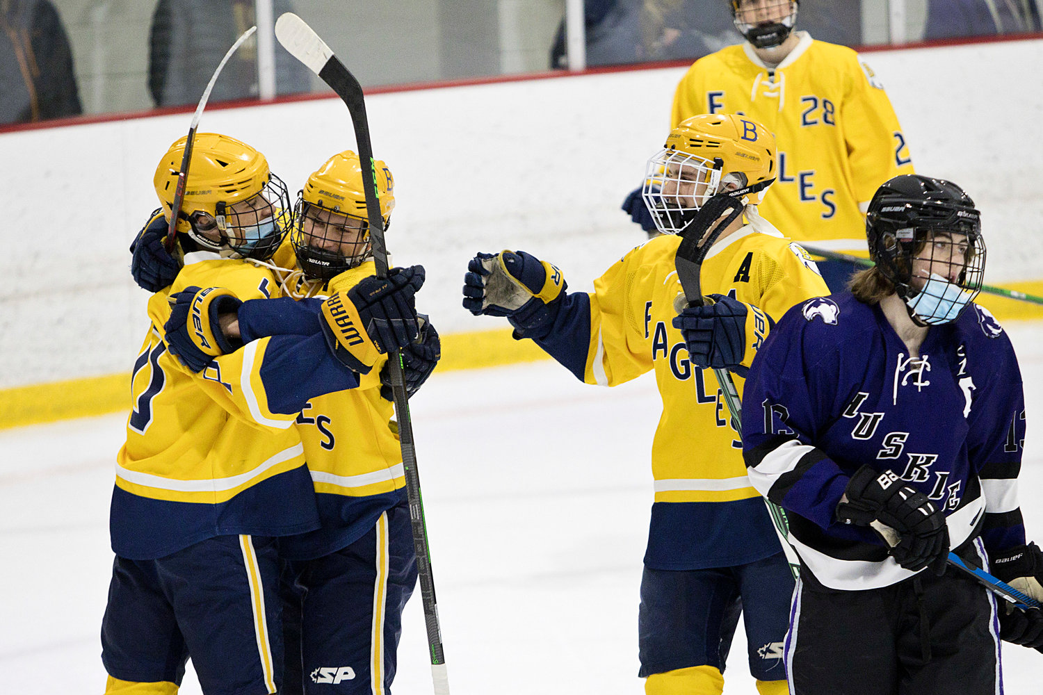 The Eagles celebrate a goal against the Huskies on Wednesday night, Jan. 5.