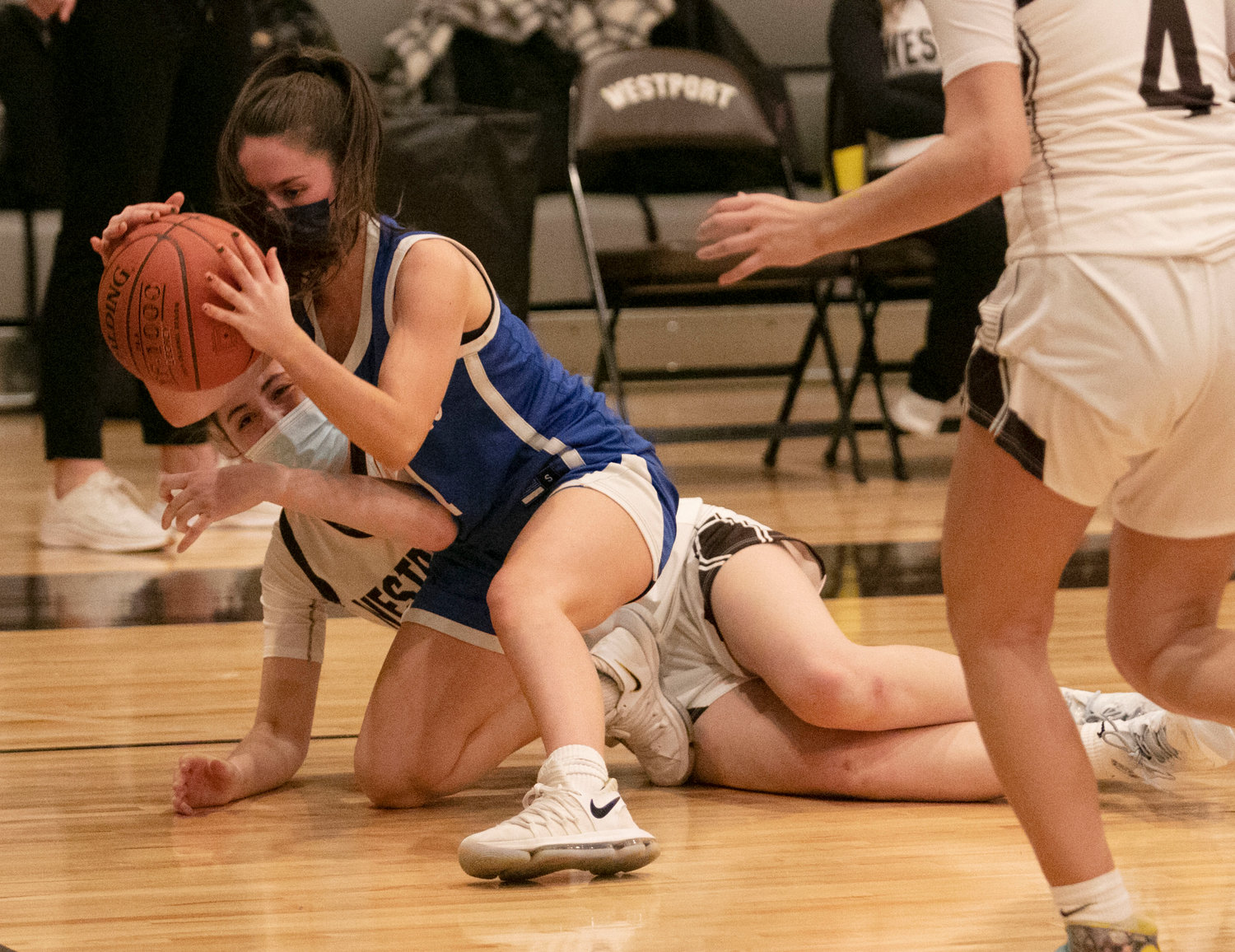 Molly Molloy falls while grabbing at a loose ball in the second half.