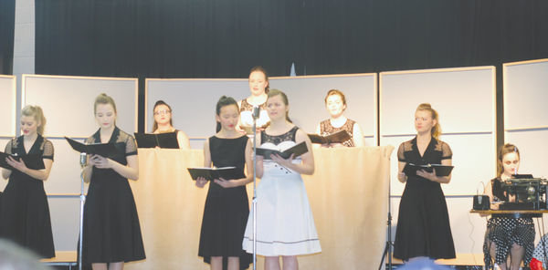 Quimby Ross, Shiloh Kirchner, Kai Li Dong, Lena McCoy, and Emma Ross took center stage for the choral reading of War of the Worlds. Jaden Templin, Liz Schacherer, Allison Young, Grace Johnson, Cathryn Houge, Maggie Domek, Olga Martin Felipe, Kiesha Smith and Ally Irwin rounded out the ensemble who also earned a One rating and a trip to state competition.  Photo by Amy H. Peterson
