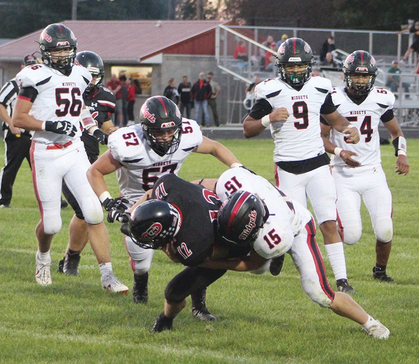 Although he had plenty of backup, ELC senior Seth Busch (15) makes the stop by himself on this play against Clarion-Goldfield-Dows on Friday. Other ELC defenders ready to assist are Jack Jensen (56), Zander Snyder, (57), Zavion McMurran (9), and Alex Pena (54).