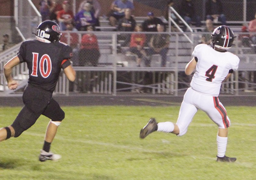 ELC’s Owen Larson gets past Clarion-Goldfield-Dows’ Cale Kirstein for this ELC touchdown in the second quarter on Friday.