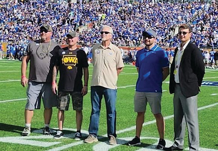 Mike Jensen and Randy Jensen, left, along with the honorary captain from Kentucky (center) were introduced to the Citrus Bowl crowd during the first TV timeout.
Photo submitted