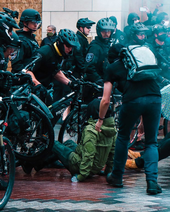 Police and protesters clash during marches in Seattle last month.&nbsp;&nbsp;