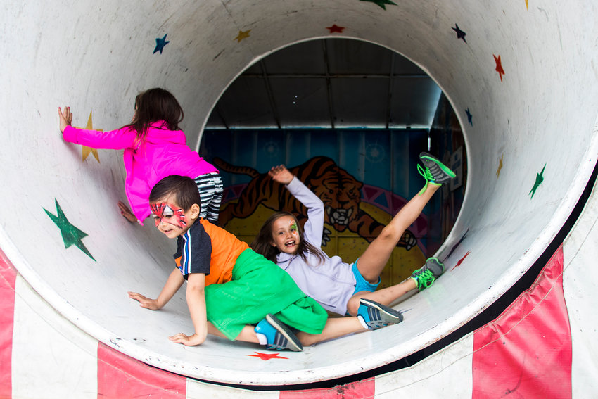 From left to right, Blakely Severns, Maxton Severns, and Brooke Severns are seen inside of a spinning funhouse tunnel during the 2018 Spring Youth Fair at the Southwest Washington Fairgrounds.