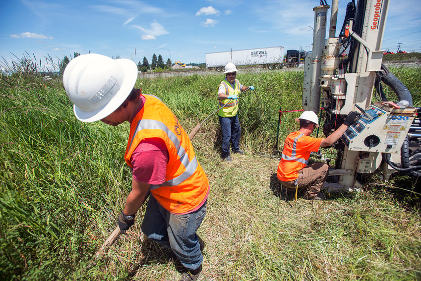 2014 CHRONICLE FILE PHOTO &mdash; Workers remove pieces of a probing drill as they bore 45 feet into the ground along Berwick Creek and Hamilton Road south of Chehalis in 2014. The companies were sub-contracted by the U.S. Environmental Protection Agency to sample soil and groundwater at the Hamilton Road Impacted Area which is part of the EPA's Hamilton/Labree Superfund Site. The EPA hoped to find the worst contamination in the area's soil so they can focus on the best ways to proceed with cleanup of the area.