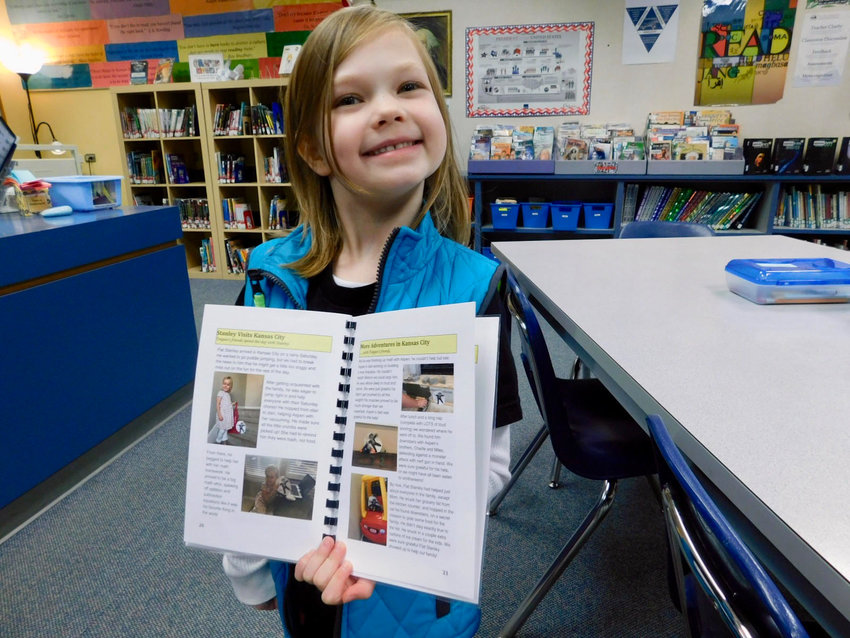 South Ridge Elementary School first-grader Teegan Thompson proudly shares her Flat Stanley pages.