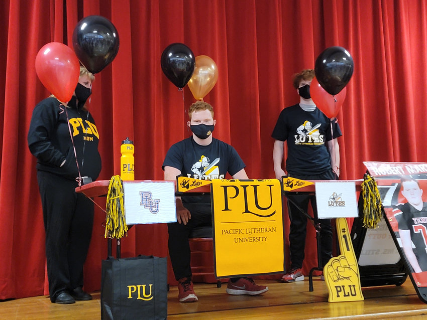 Tenino senior Robert Marti committed to Pacific Lutheran Football during a signing event at Tenino High School on Tuesday.