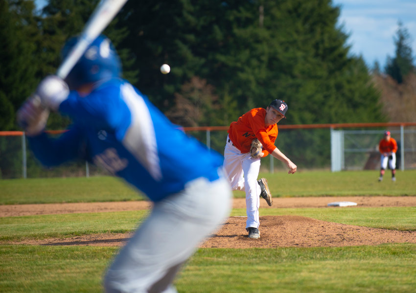 Napavine senior ace Laythan Demarest throws against Toutle Lake in the second inning of the Tigers' season opener on Tuesday.
