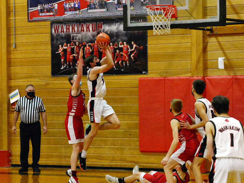 Wahkiakum's Jake Leitz goes up to the basket in the second half of the Mules' 68-47 win over Toledo on Thursday, May 6. Leitz finished with a team-high 21 points.