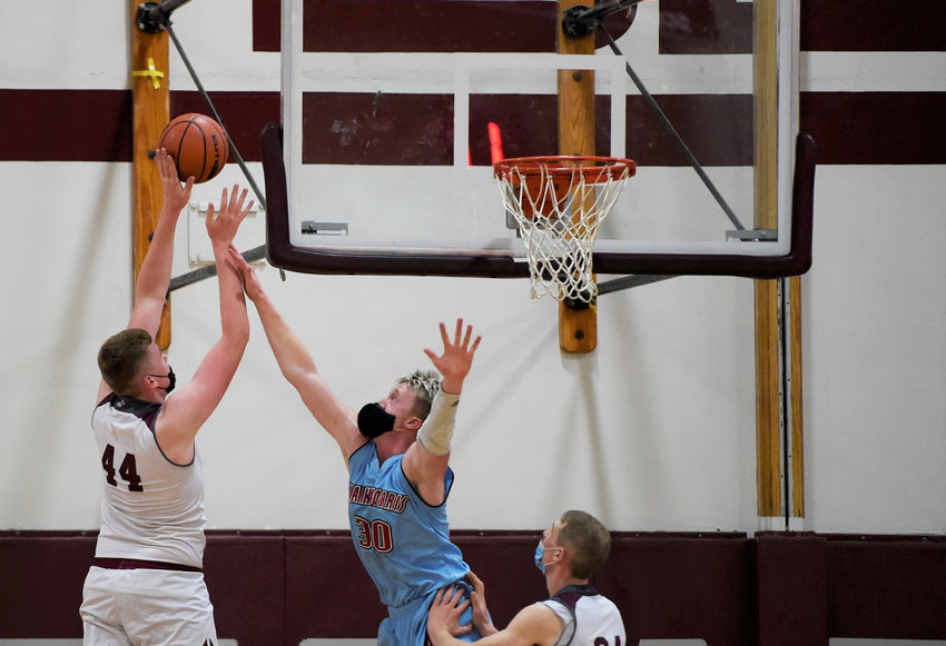 W.F. West's Soren Dalan goes up for two points against Mark Morris on Thursday at home.