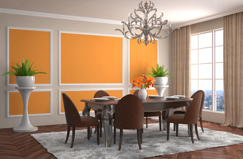 Pops of color and a statement chandelier can help draw attention to dining room spaces.