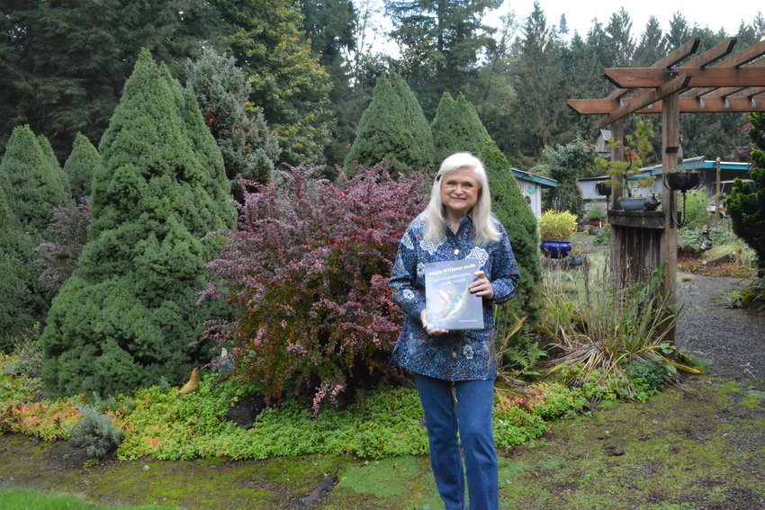 Dr. Gerry Dunne is pictured in front of her garden at her home.