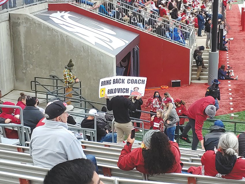 A Washington State University fan holds a sign during Saturday&rsquo;s game against Brigham Young in this photograph provided by Chronicle columnist Julie McDonald. &ldquo;I couldn&rsquo;t disagree more with the sign,&rdquo; McDonald wrote.