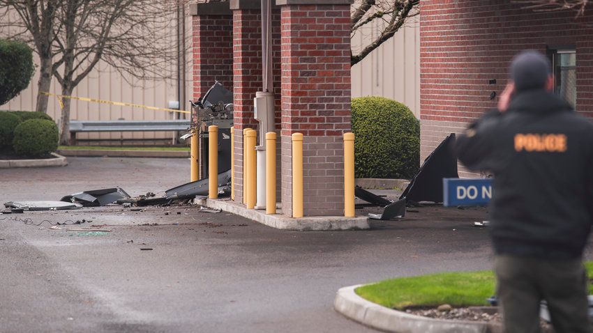 Debris are seen scattered in an area where an ATM once stood outside the 1st Security Bank in Centralia last month.