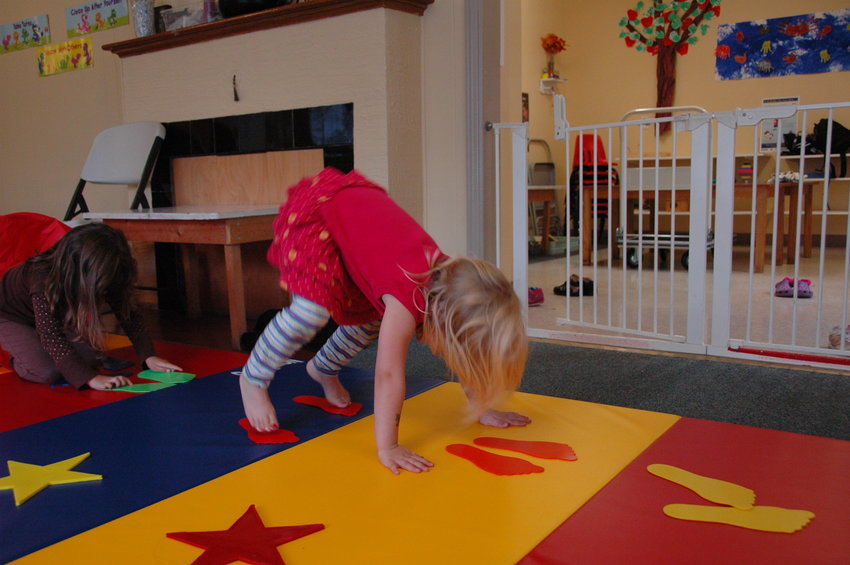 A girl exercises on a mat at Jump Start Gymnastics.