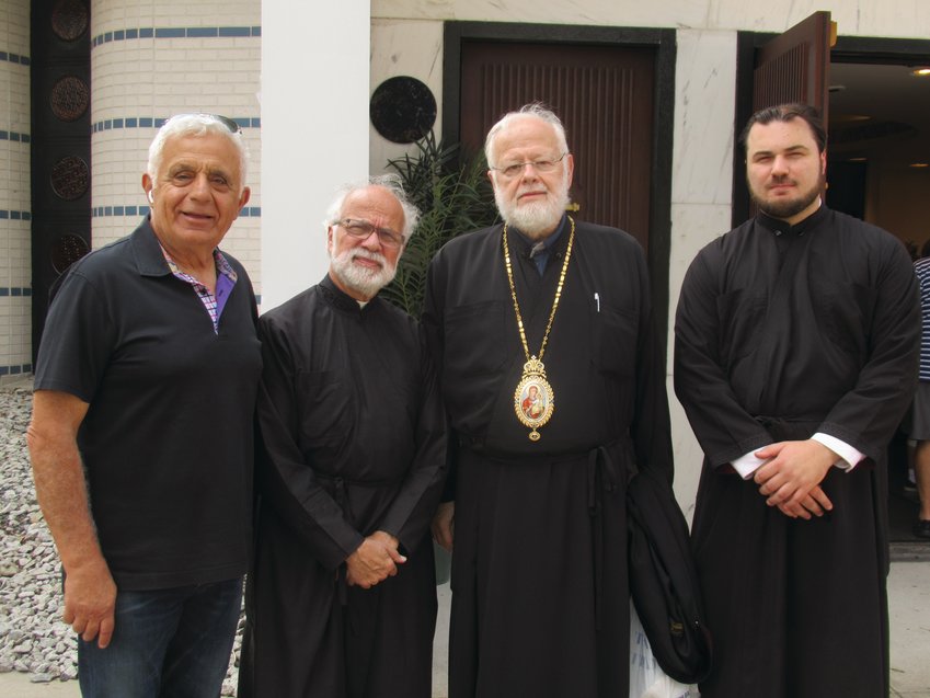 GRAND GUEST: His Eminence Metropolitan Methodios of Boston made a special visit to the Cranston Greek Festival Sunday and was warmly welcomed by parishioner Gus Perdikakis, Father Andrew George and Assistant Nick Lanzourakis.